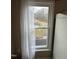 Window view overlooking greenery with stream, visible from neutral-colored bedroom at 4051 Silk Hope Gum Springs Rd, Pittsboro, NC 27312