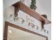 Charming bathroom featuring a wood shelf, vanity mirror, and stylish lighting fixtures at 407 Crickentree Dr, Cary, NC 27518