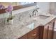 Bathroom vanity featuring granite countertop and undermount sink with chrome faucet at 407 Crickentree Dr, Cary, NC 27518