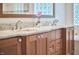 Double sink bathroom vanity featuring a granite countertop and wood cabinets at 407 Crickentree Dr, Cary, NC 27518
