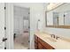 Hall bathroom with wood vanity and built-in sink at 407 Crickentree Dr, Cary, NC 27518