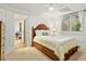 Cozy bedroom with carpet, natural light, and a bed with under-bed storage at 407 Crickentree Dr, Cary, NC 27518