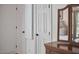 Bedroom featuring closet with integrated ironing board, cabinets, and wood dresser with mirror at 407 Crickentree Dr, Cary, NC 27518