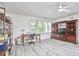 Versatile bonus room with wood laminate flooring, natural light, and flexible space at 407 Crickentree Dr, Cary, NC 27518