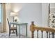 Hallway featuring a desk, lamp, and chair for a serene workspace, complemented by a decorative blanket ladder at 407 Crickentree Dr, Cary, NC 27518