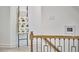 Hallway displaying modern blanket ladder with stylish blanket near the staircase, offering a decorative touch at 407 Crickentree Dr, Cary, NC 27518