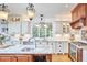 Kitchen includes hardwood floors, granite counters, stainless appliances, and custom cabinets at 407 Crickentree Dr, Cary, NC 27518