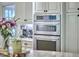 Kitchen boasts stainless oven, granite countertops, and built-in appliances at 407 Crickentree Dr, Cary, NC 27518