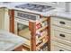 Gourmet kitchen features custom spice racks, granite counters, and stainless steel appliances at 407 Crickentree Dr, Cary, NC 27518