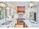 Charming kitchen boasts granite countertops, stainless steel appliances, and custom cabinetry at 407 Crickentree Dr, Cary, NC 27518
