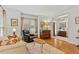 Cozy living room featuring hardwood floors, large windows, and comfortable seating at 407 Crickentree Dr, Cary, NC 27518