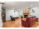 Cozy living room features a stone fireplace, hardwood floors, and comfortable seating at 407 Crickentree Dr, Cary, NC 27518