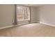 Bedroom with neutral paint, carpet flooring and a large window with natural light at 4325 New Hope Springs Dr, Hillsborough, NC 27278