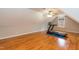 Bonus room showcasing wood floors, a ceiling fan, a treadmill and a window at 4325 New Hope Springs Dr, Hillsborough, NC 27278