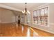 Open dining area adjacent to the living room and kitchen with hardwood floors and natural light at 4325 New Hope Springs Dr, Hillsborough, NC 27278