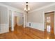 The dining room features hardwood floors, decorative trim, and a classic chandelier at 4325 New Hope Springs Dr, Hillsborough, NC 27278