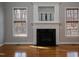 The living room's fireplace features a decorative white mantel with a black marble hearth at 4325 New Hope Springs Dr, Hillsborough, NC 27278