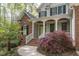 Charming two-story home with a brick facade, covered porch, and well-manicured landscaping at 4325 New Hope Springs Dr, Hillsborough, NC 27278