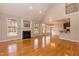 Bright living room boasts hardwood floors, fireplace and large windows filling the space with natural light at 4325 New Hope Springs Dr, Hillsborough, NC 27278