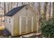 Exterior of the shed on the property, with double doors and a clean, neutral color at 4325 New Hope Springs Dr, Hillsborough, NC 27278