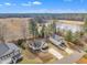 Aerial view showcases the house, neighboring properties, and scenic pond, creating a beautiful neighborhood setting at 505 Wild Goose Ln, Creedmoor, NC 27522