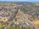 Neighborhood aerial view features charming homes, mature trees, and a community pond at 505 Wild Goose Ln, Creedmoor, NC 27522