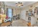 Comfortable bedroom with a ceiling fan, carpet, and a well-lit study area at 505 Wild Goose Ln, Creedmoor, NC 27522