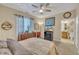 Bedroom features a ceiling fan, dresser, and an ensuite bathroom, creating a comfortable retreat at 505 Wild Goose Ln, Creedmoor, NC 27522