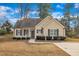 Charming single-story home with a well-manicured lawn and inviting front entrance at 505 Wild Goose Ln, Creedmoor, NC 27522