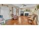 Cozy living room with hardwood floors, a fireplace, and comfortable seating at 505 Wild Goose Ln, Creedmoor, NC 27522