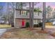 Charming two-story home with a red front door, brick and vinyl siding at 510 N Mineral Springs Rd, Durham, NC 27703