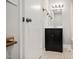 Bathroom featuring a black vanity, mirror, and neutral patterned flooring at 512 S Mebane St, Burlington, NC 27215