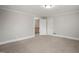 Cozy bedroom with carpet and two doors, providing a warm and inviting space at 512 S Mebane St, Burlington, NC 27215