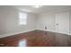Hardwood flooring and natural light enhance this inviting bedroom space at 512 S Mebane St, Burlington, NC 27215