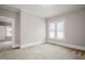 Spacious bedroom boasting neutral walls and plush carpeting at 512 S Mebane St, Burlington, NC 27215