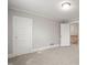 Bright room with two doors and carpet, providing a cozy and functional space at 512 S Mebane St, Burlington, NC 27215