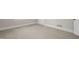 Bright room with carpet, base trim and a door at 512 S Mebane St, Burlington, NC 27215