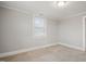 Cozy bedroom features carpet and a window, offering natural light and space at 512 S Mebane St, Burlington, NC 27215