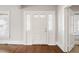 Bright entryway featuring a classic door with sidelights and stylish trim, leading to a warm interior at 512 S Mebane St, Burlington, NC 27215
