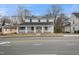 Charming two-story home with a welcoming front porch, mature trees, and classic architectural details at 512 S Mebane St, Burlington, NC 27215