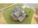 Birds eye view of a two-story house with a well-kept roof and backyard at 5705 Flowery Meadow Ct, Wake Forest, NC 27587