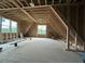 Unfinished attic features wood beams and framed windows at 5705 Flowery Meadow Ct, Wake Forest, NC 27587