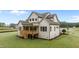 Stunning home features a large back deck and well-manicured lawn at 5705 Flowery Meadow Ct, Wake Forest, NC 27587