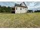 Spacious backyard with a large lawn and a view of the home's rear elevation at 5705 Flowery Meadow Ct, Wake Forest, NC 27587