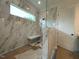 Modern bathroom with marble shower, rain shower head, and a built-in bench at 5705 Flowery Meadow Ct, Wake Forest, NC 27587