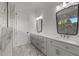 Bright bathroom features a double vanity with quartz countertops and modern fixtures at 5705 Flowery Meadow Ct, Wake Forest, NC 27587