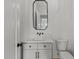 Stylish bathroom with a modern mirror, granite countertops, and white commode at 5705 Flowery Meadow Ct, Wake Forest, NC 27587