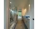 Bathroom featuring a walk-in shower, vanity with double sinks, and a view of the outdoors at 5705 Flowery Meadow Ct, Wake Forest, NC 27587