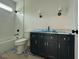 Bathroom features a tiled shower over tub combo, and modern fixtures at 5705 Flowery Meadow Ct, Wake Forest, NC 27587
