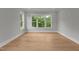 Spacious bedroom with natural lighting and beautiful hardwood floors at 5705 Flowery Meadow Ct, Wake Forest, NC 27587